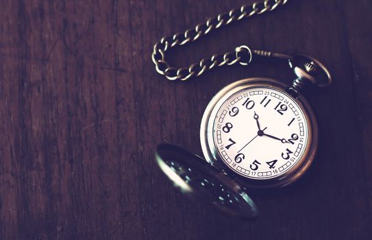 Time management concept, business planning, retro clock on vintage background 