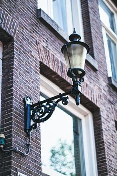 Architectural detail of a building on the main city center street of Amsterdam in Netherlands, european architecture