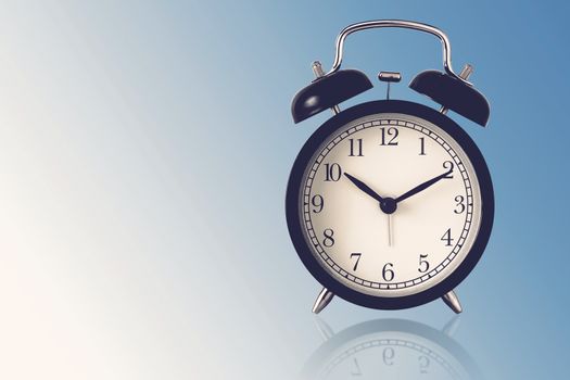 Time management concept, business strategy and planning, retro alarm clock on blue vintage background