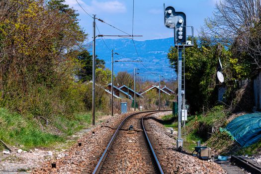 Railroad tracks through a Swiss village near the French border - image