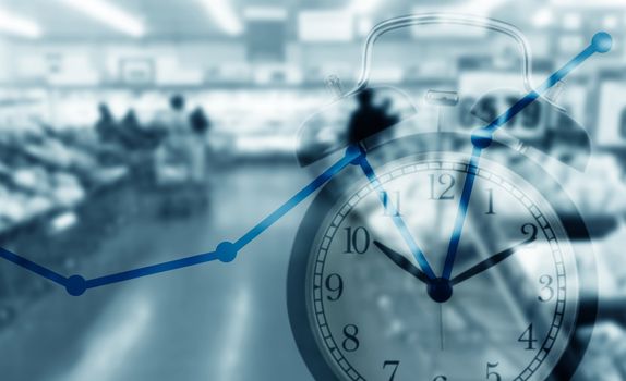 Time management concept, business planning, alarm clock and growing graph on blue background 