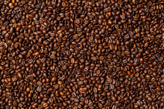 Close-up of brown, roasted coffee beans  background - image