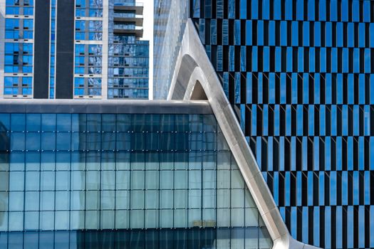 close-up of glass office building facade with windows, texture, architecture