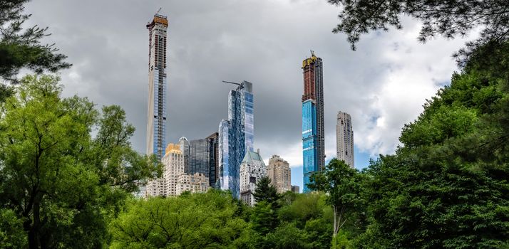Trees in Central Park with a view of the Central Park South skyline in midtown Manhattan, New York City