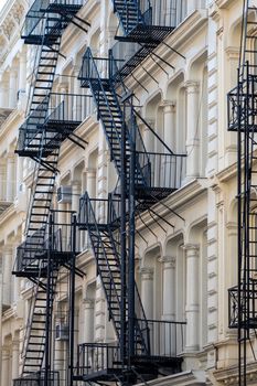 architectural detail view of traditional cast iron buildings in the Soho Cast Iron Historic District in downtown Manhattan, New York City