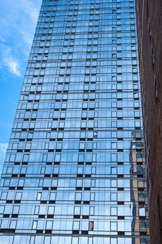 close-up of glass office building facade with windows, texture, architecture