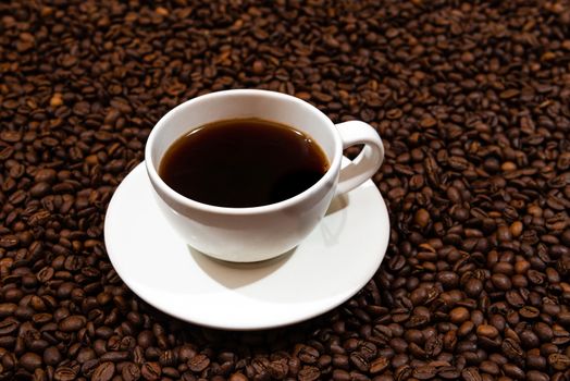 White coffee mug on the coffee beans background - image