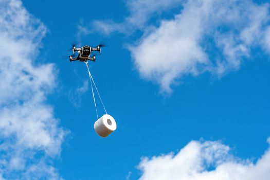 the drone is flying with the toilet paper roll to the customer, concept of Drone delivery