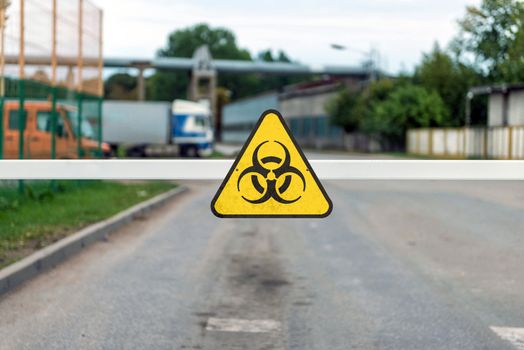 automatic barrier with a Coronavirus Warning sign, Covid-19 containment concept
