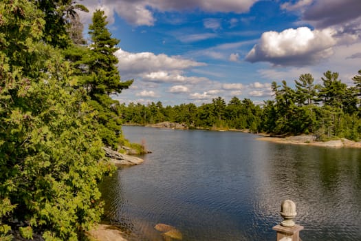 Georgian Bay coastline with red rocks and pine trees.