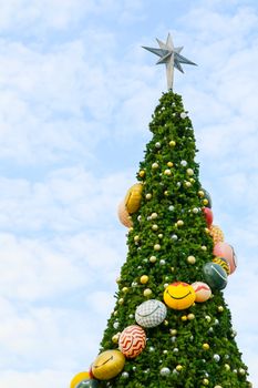 Christmas tree has green leaves and decorated with various items to celebrate Christmas festival and new year