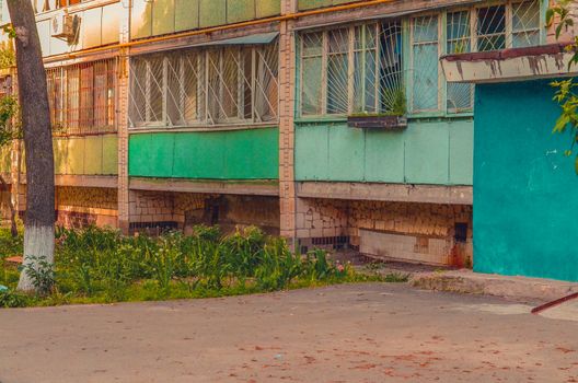 Balconies with windows on the old high-rise building