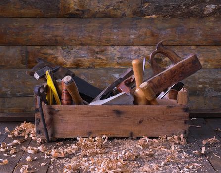 Old toolbox on the workbench in a carpentry