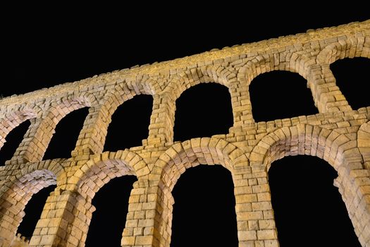 Night view of famous ancient aqueduct in Segovia, Castilla y Leon, Spain.