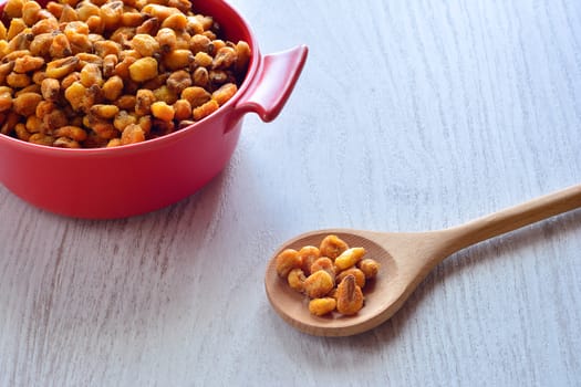 Toasted corn on the wooden table in the kitchen.