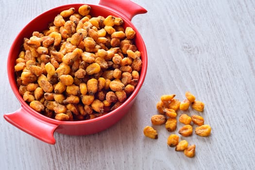 Toasted corn on the wooden table in the kitchen.