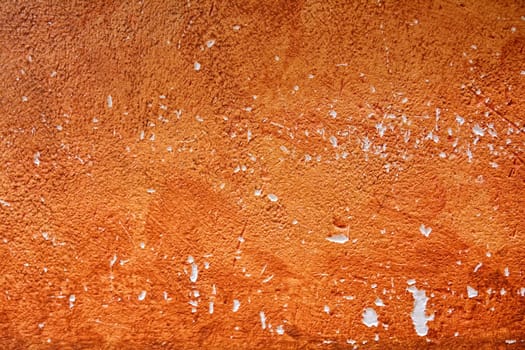 Background painted wall with damage to orange