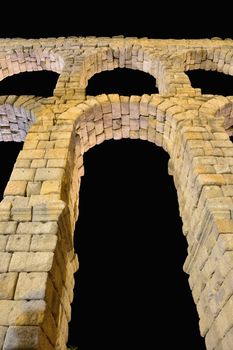 Night view of famous ancient aqueduct in Segovia, Castilla y Leon, Spain.