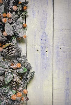 Christmas decoration full of frost on the wooden table