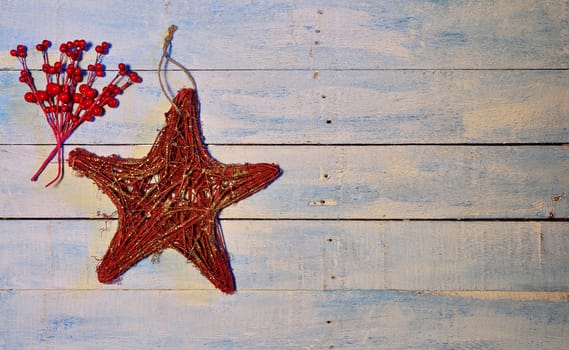 Christmas decorations over old wooden table.