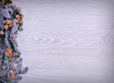 Christmas decoration full of frost on the wooden table