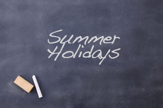 Blackboard school class with the phrase Summer Holidays.
