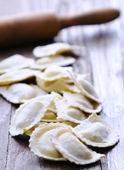 Preparing fresh ravioli at the kitchen table.