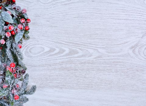 Christmas decoration full of frost on the wooden table