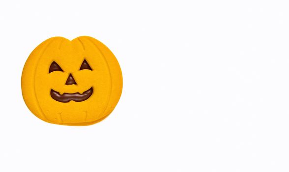 Isolated halloween cookie with pumpkin shape.