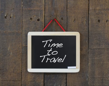 Blackboard hanging with the phrase Time to Travel.
