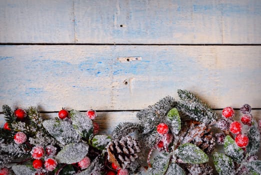 Christmas decoration full of frost on the wooden table