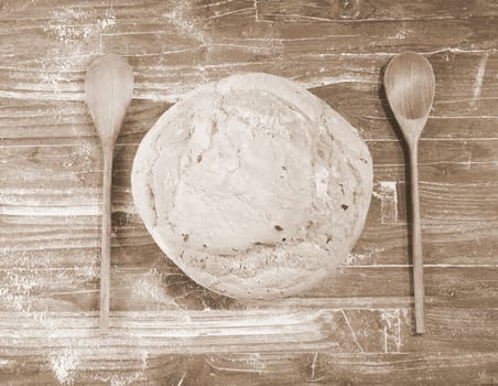 Bread on the table with wooden cutlery.