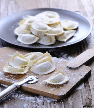 Preparing fresh ravioli at the kitchen table.