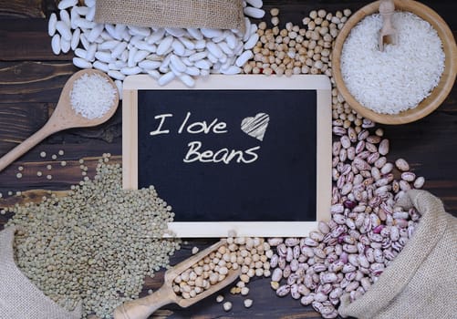 Legumes on wooden table in the kitchen