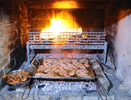 Preparing delicious prawns grilled in the restaurant