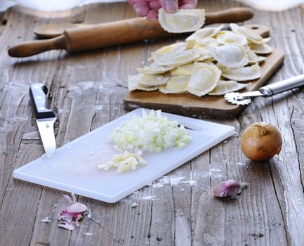 Preparing fresh ravioli at the kitchen table.
