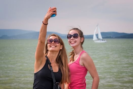 Two young girls make selfi