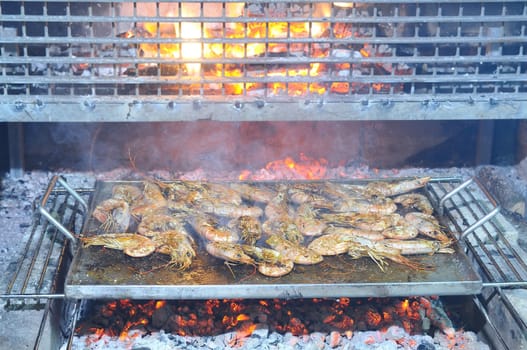 Preparing delicious prawns grilled in the restaurant