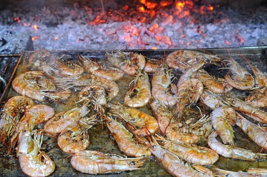 Preparing delicious prawns grilled in the restaurant