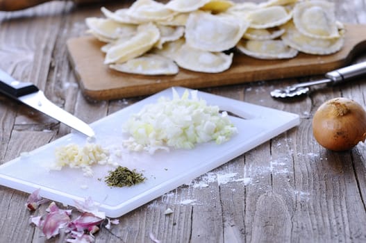 Preparing fresh ravioli at the kitchen table.