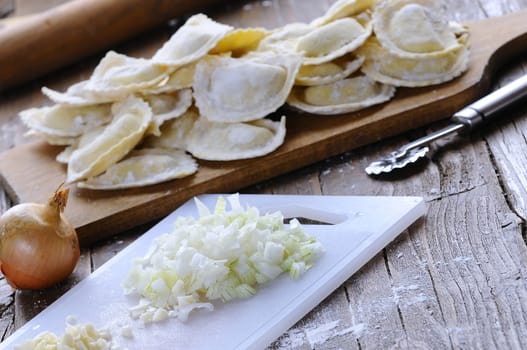 Preparing fresh ravioli at the kitchen table.