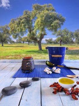 Wooden table in the sauna area with oils and hot stones.