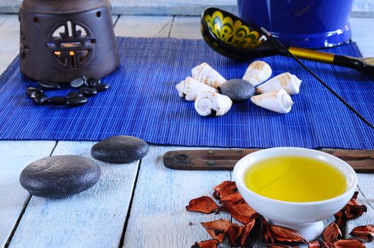 Wooden table in the sauna area with oils and hot stones.