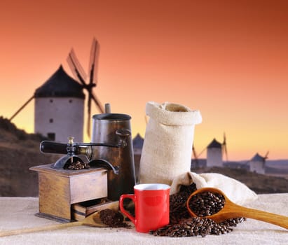 Coffee cup and old windmill in background.