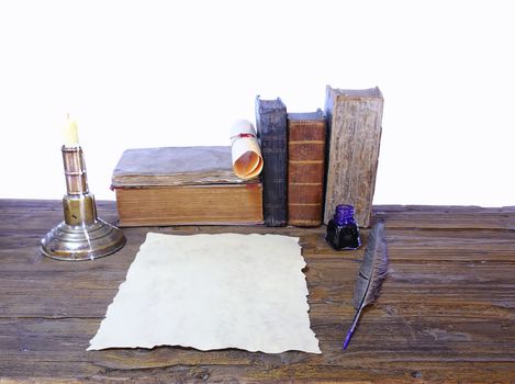 Work desk with parchment and old books.