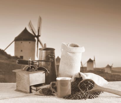 Coffee cup and old windmill in background.