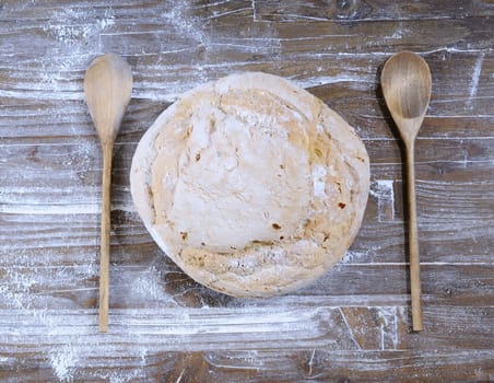 Bread on the table with wooden cutlery.