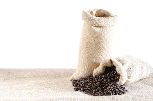 Isolated bags of coffee beans on the table.