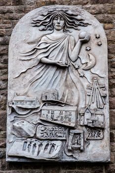 Stone plaque with a very simple symbolism of the spirit of Heysham UK