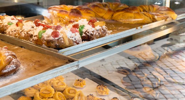 succulent Portuguese pastries displayed in the pastry cook's window in Porto